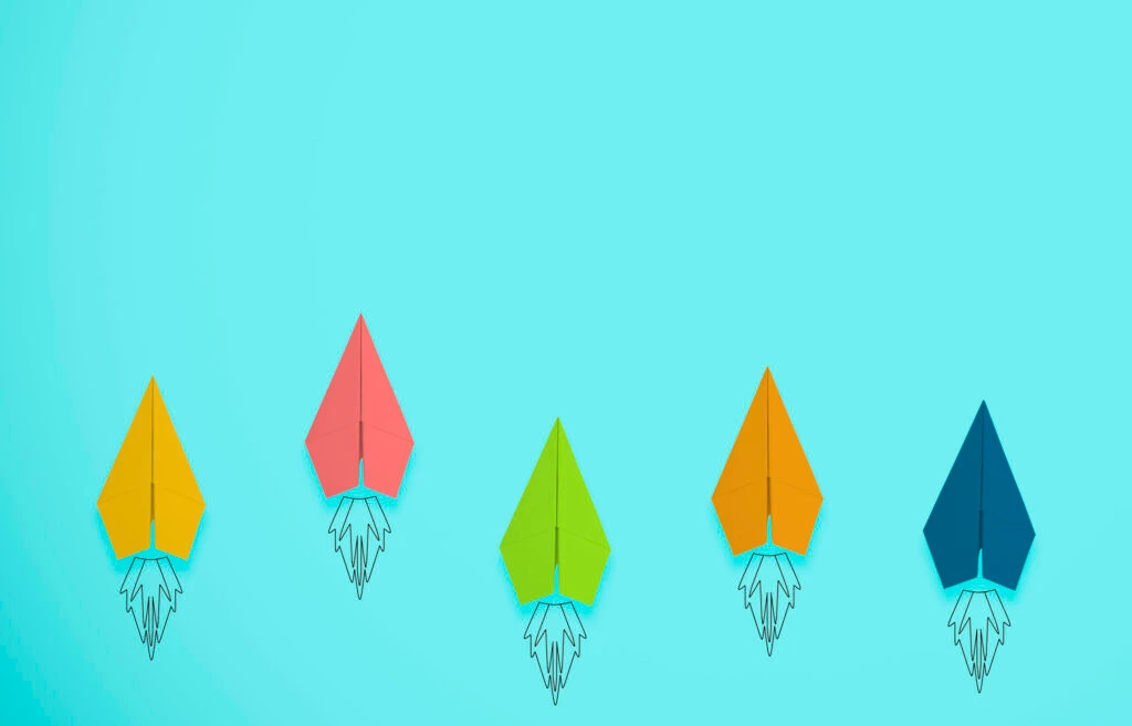 multicoloured paper rockets symbolising brand performance improving